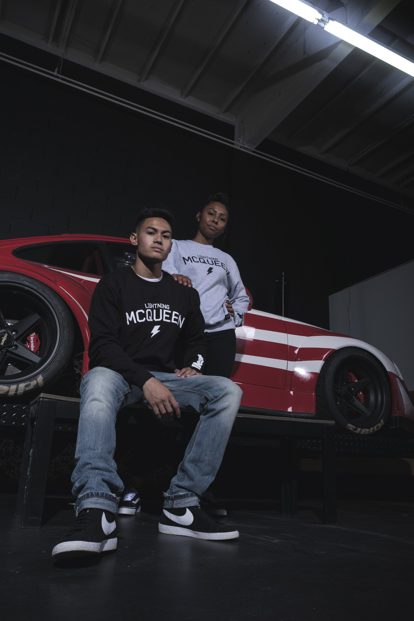 Model Noel and Eryka in front of Prosche RWB WU