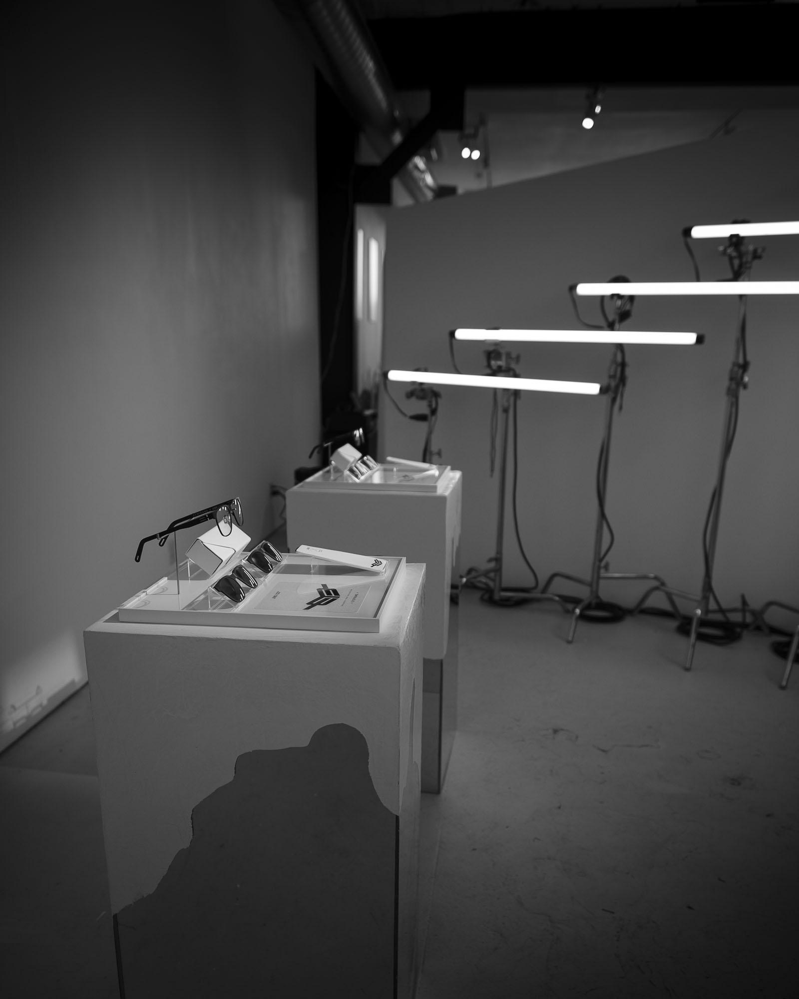 EYE Frame display fixture under dramatic lighting